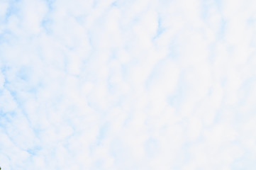 Blue sky on a sunny day with fluffy clouds