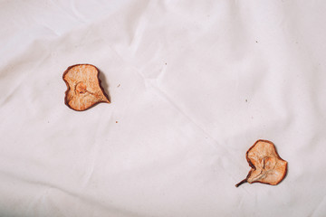 Dry pears on white canvas