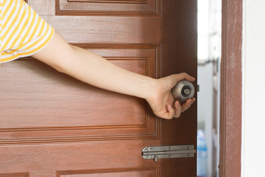 Women hand open door knob or opening the door,grand opening,Close up hand open door.