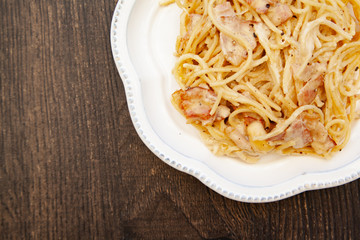 Carbonara pasta, spaghetti with pancetta, egg, hard parmesan cheese and cream sauce. Traditional italian cuisine