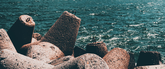 Concrete barrage prevents waves in the seaport.