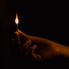 Matchstick burning in darkness