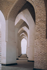 Fototapeta na wymiar Middle Asia. Uzbekistan Bukhara. white arched openings create a corridor