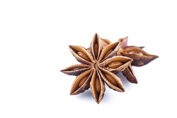 star anise on white background front view close up.