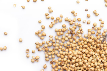 coriander seeds top view on white background.