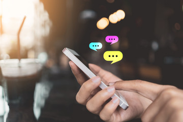 Woman hand using smart phone at coffee shop with email icon flying and line dot abstract. Technology business and freelance concept.