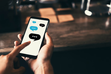 Woman hand using smart phone at coffee shop with email icon flying and line dot abstract. Technology business and freelance concept.