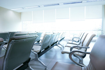 Row of empty seats in airport lobby,An empty row of chair at airport