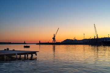 Fototapeta na wymiar Contrasting color over the evening harbour