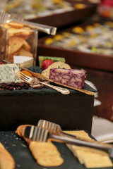 Cheese shop serving of tasty cheeses and crackers