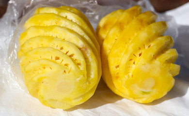 Sliced pineapple slices on the table.