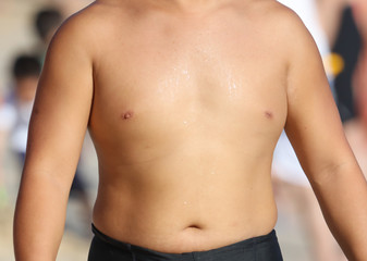 Fototapeta na wymiar The bare chest of an Asian man