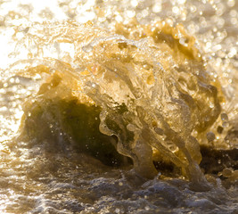 Splashing dirty water from the sea.