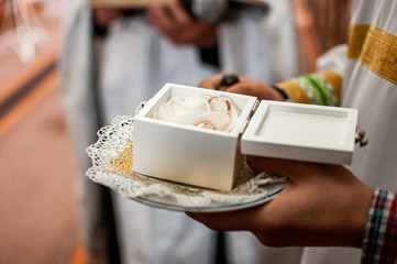 Gold wedding rings in the white box