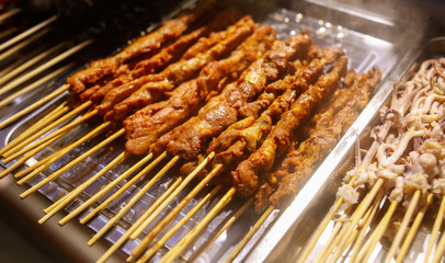 Meat on skewers for frying on the grill.