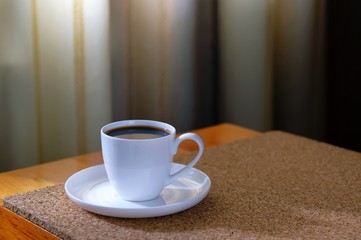 A Cup of coffee on the table surface