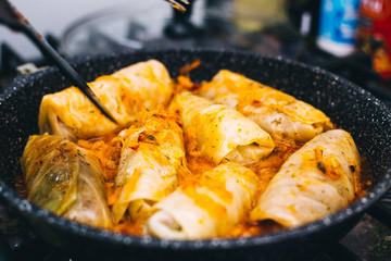 Stuffed cabbage is cooked in a pan, orange color