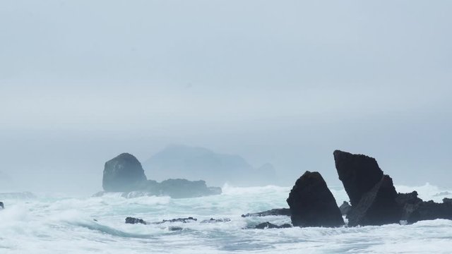 Beautiful Papuma beach with corals and frothy waves