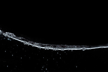 Surface fresh water splash with air bubble in abstract background and black and white tone