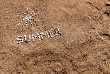 Summer picture from pebble and sand on a beach