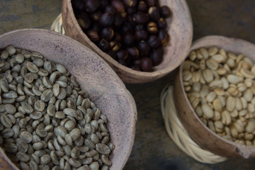White coffee beans on old rusty background