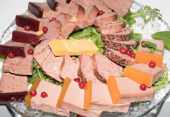 Selection of fresh cuts antipasto: ham, cheese