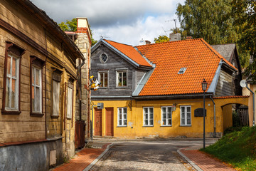 Fototapeta na wymiar CESIS / LATVIA - SEPTEMBER 2015: Street with residential houses in the old town of Cesis, Latvia
