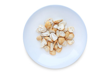 Straw mushroom on white circle ceramic plate isolated over background. Cut half