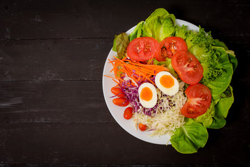Vegetables Salad on black  wooden  background