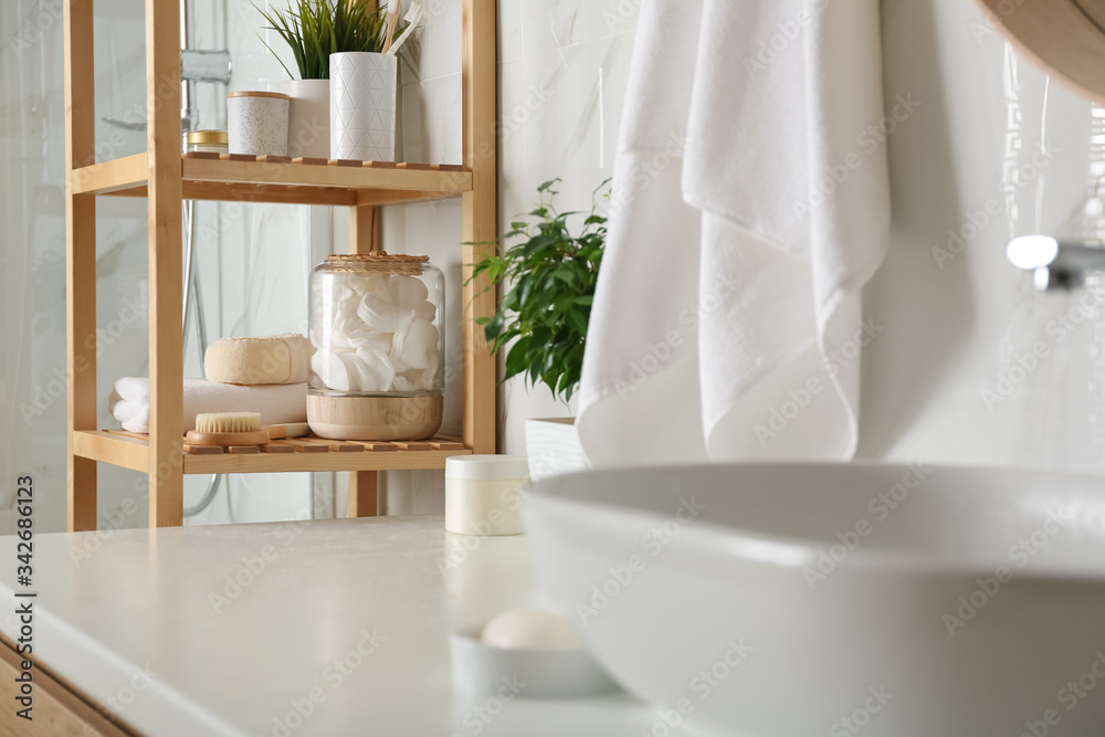 Sticker Shelving unit with toiletries in bathroom interior