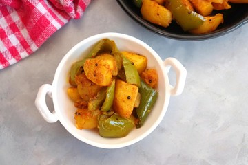 Indian food - Spicy Capsicum and potato stir fried with Indian spices. Aloo and Shimla Mirchi....