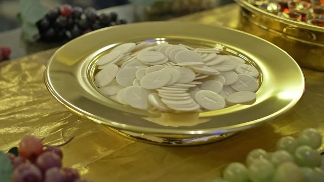 Closeup of sacrament bowl, Christian religious etiquette, holy bread and wine