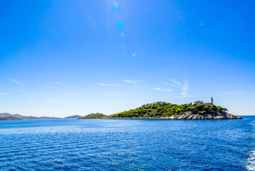 Landscape of croatian island with lighthouse on Vela Sestrica near Kornati, Adriatic Sea, Croatia....