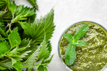Detox juice or green smoothie, healthy drink with leaves of nettle