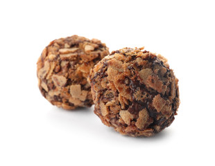 Delicious chocolate candies with waffle crumbles isolated on white