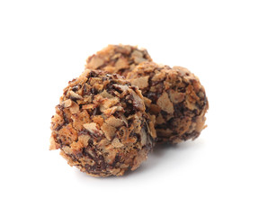 Delicious chocolate candies with waffle crumbles isolated on white