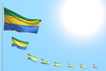 nice many Gabon flags placed diagonal with selective focus and empty place for your text - any holiday flag 3d illustration..