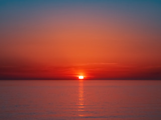 Beautiful bright red sea sunset without people and objects