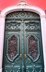 Old and colorful carved wood door with iron details
