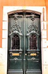 Old and colorful carved wood door with iron details