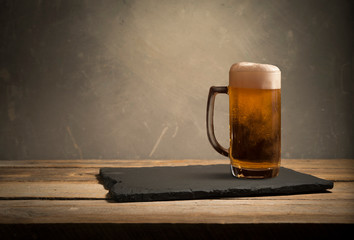 Old wooden barrel on a brown background