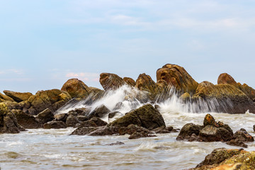 Stone in sea with wave at Mui Ne, Phan Thiet, Binh Thuan, Vietnam