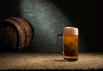 Old wooden barrel on a brown background