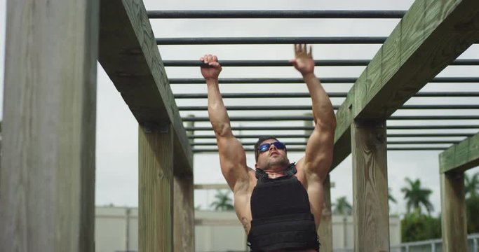 Athletic man performing obstacle course training