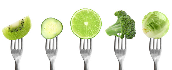 Forks with different vegetables and fruits on white background, banner design. Healthy meal