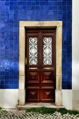 Old and colorful wooden door with iron details