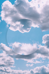 Aesthetic art collage with beautiful blue sky and mirror reflection in circle frame. Minimal