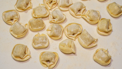 Delicious tortellini a ring-shaped pasta from Italy. Traditionally they are stuffed with a mix of meat, parmigiano reggiano cheese, egg and nutmeg