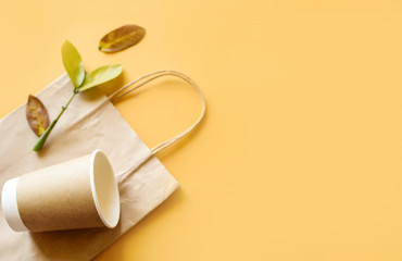 Set of unbleached plant fiber food box and paper coffee cup. Natural fiber eco food and drink packaging.