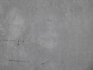 The texture of a concrete wall at close range. Grey concrete background.  